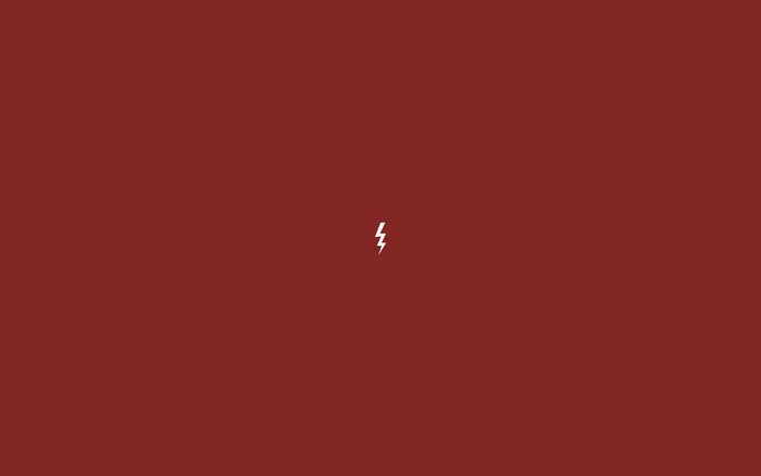 Minimalist lightning bolt on red background
