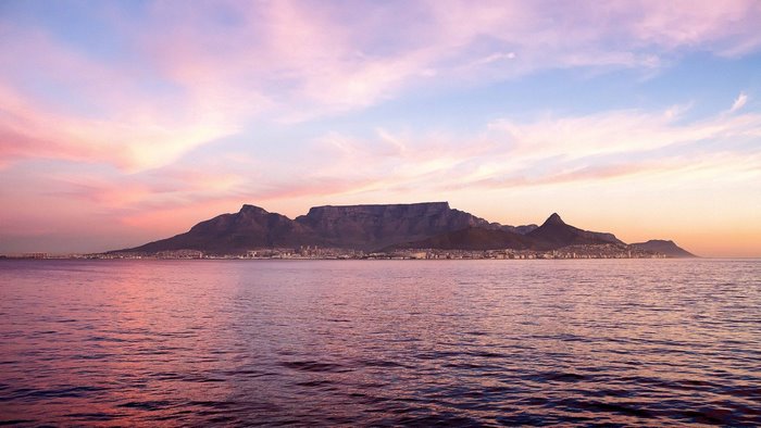 Table Mountain and Cape Town at Sunset over the Sea