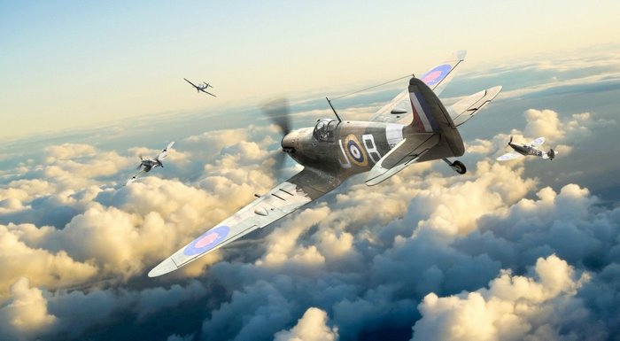 Supermarine Spitfires in aerial combat over clouds