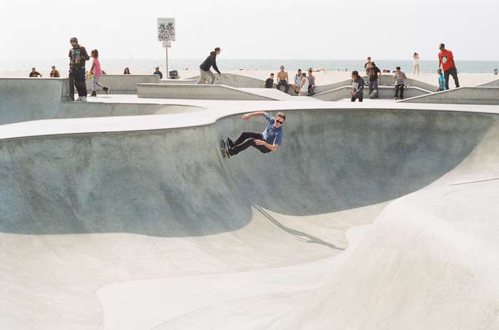 Skateboarder performing a trick in a skatepark