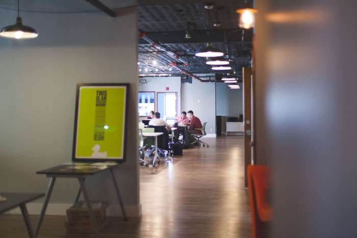 Office interior with people working at desks