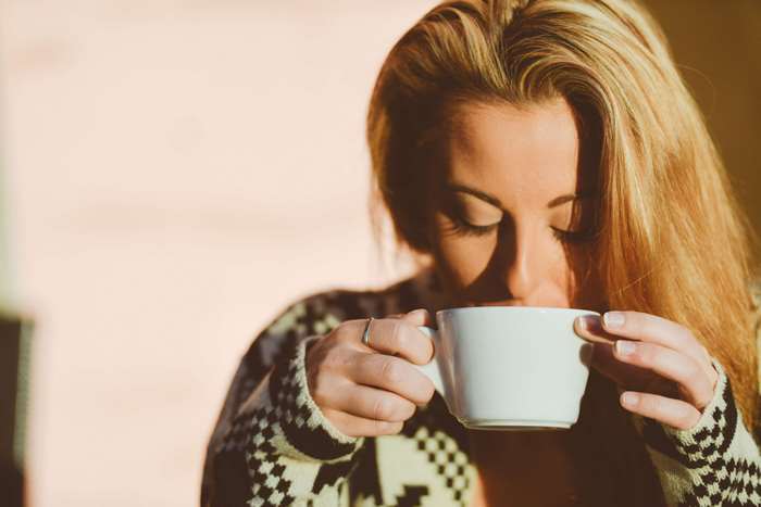 Woman drinking coffee from a mug