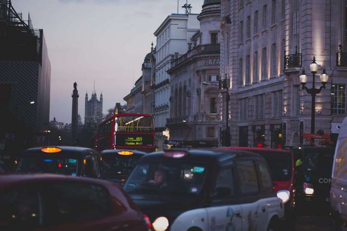 London traffic jam with red bus and black taxis