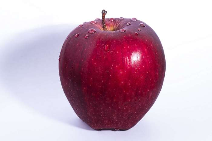 Red apple with water droplets 4K