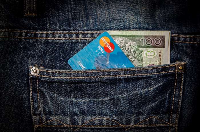 Mastercard Debit Card and Money in Jeans Pocket 4K
