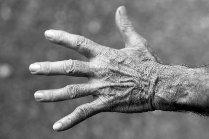 Black and white image of an elderly hand