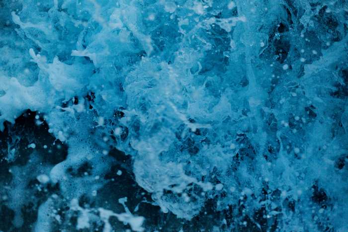 Close-up of blue ocean water splashing