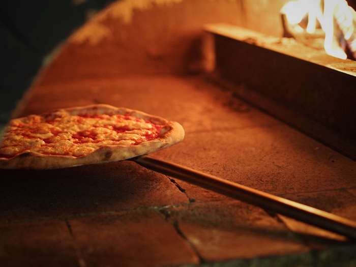 Pizza Baking in a Wood-Fired Oven 4K
