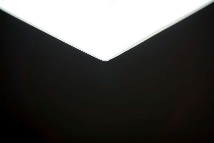 Minimalist abstract of white light and black.