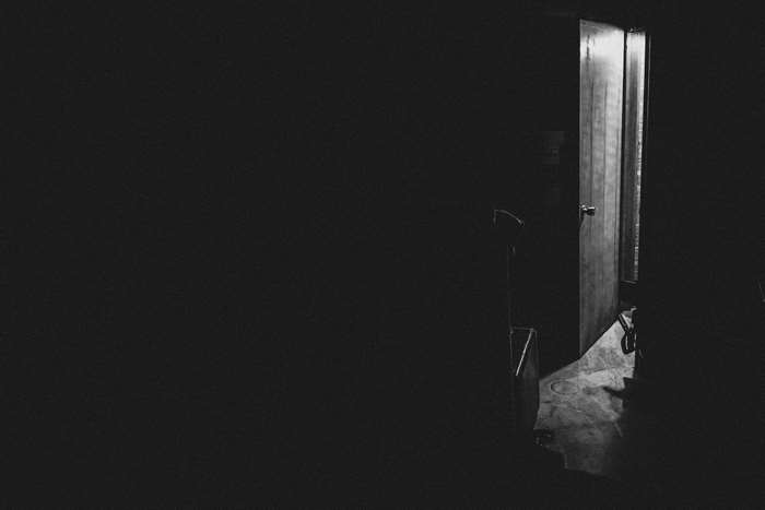 Open door in a dark room