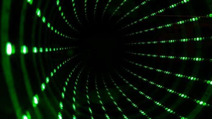 Green lights in a dark tunnel