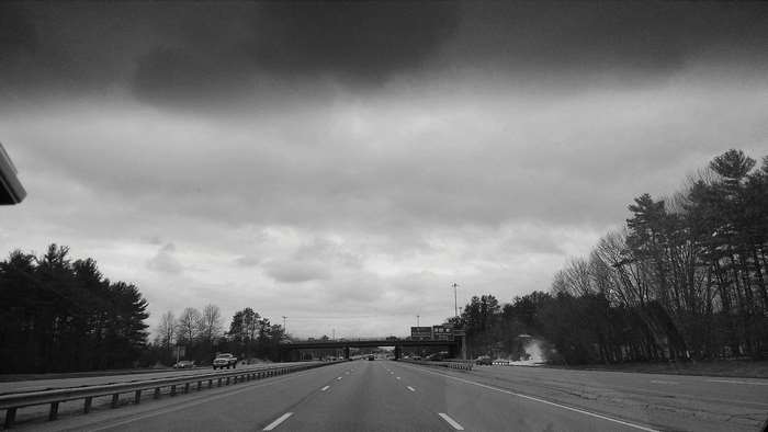 Highway travel under cloudy skies