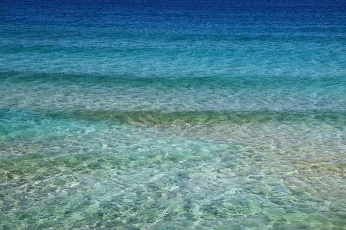 Blue ocean water with shallow waves