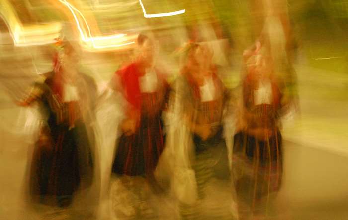 People in traditional clothing dancing