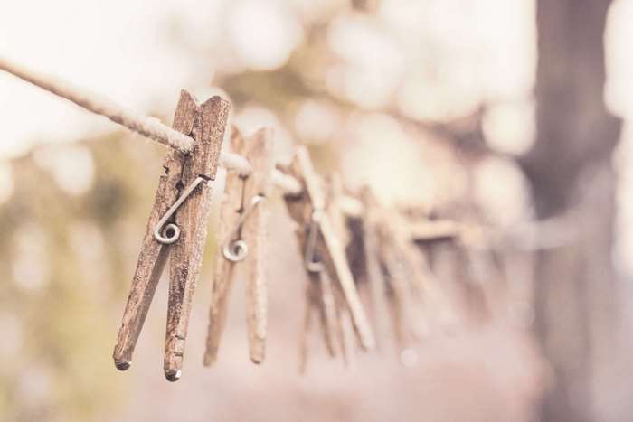 Wooden clothespins on a clothesline