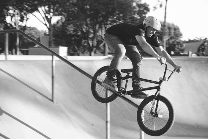 BMX rider performing a stunt on a ramp