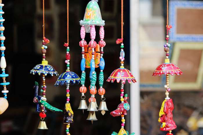Colorful handicraft wind chimes with bells and umbrellas