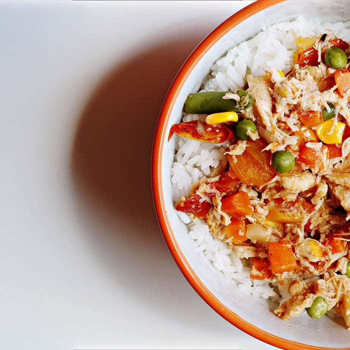 Bowl of rice with chicken and vegetables 4K