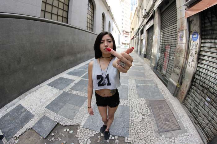 Girl showing middle finger in SP street