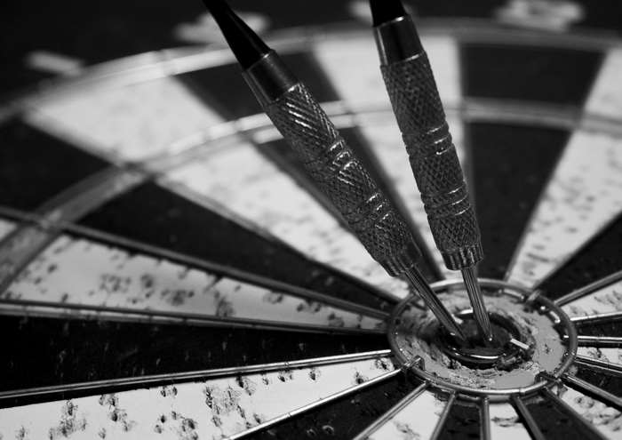 Two darts in a dartboard