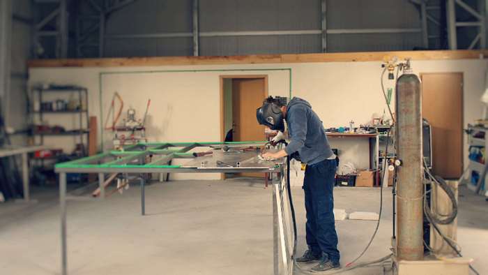 Welder working in an industrial workshop
