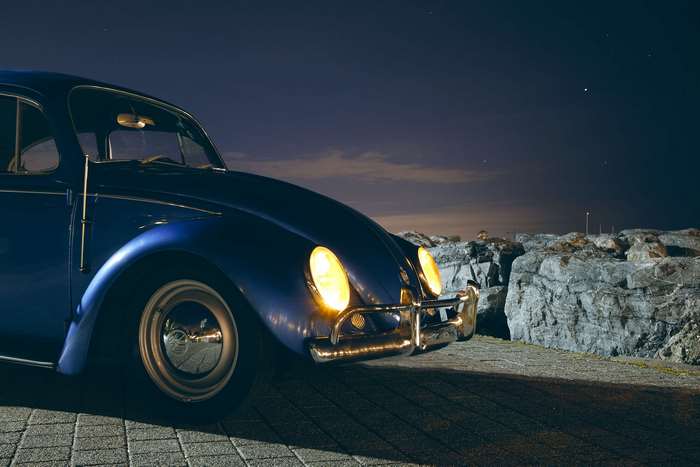 Blue Volkswagen Beetle at Night