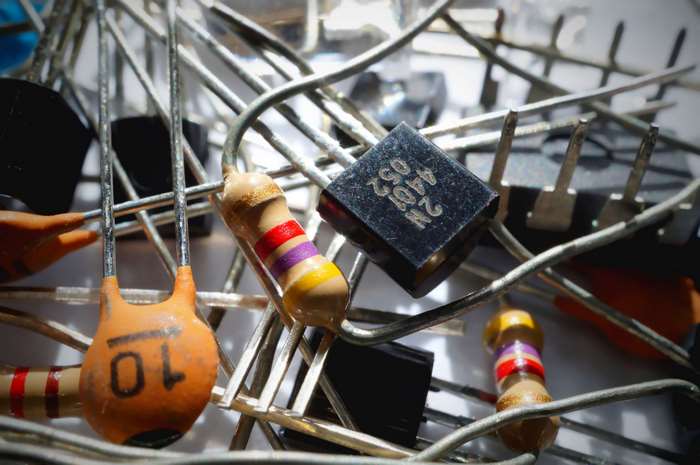 Macro shot of electronic components, resistors, capacitors, and transistor