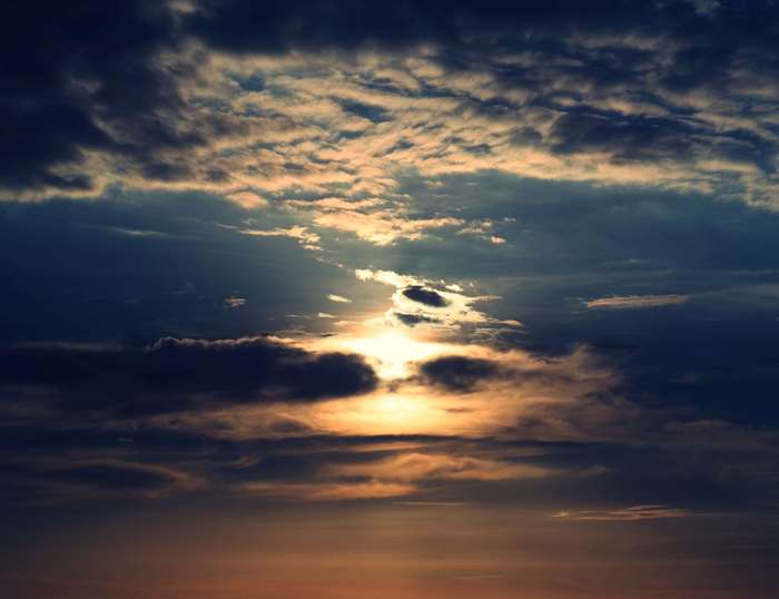 Sunset with dark clouds and sun rays 4K