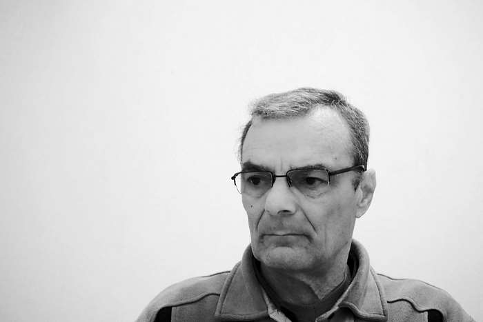 Portrait of an older man wearing glasses