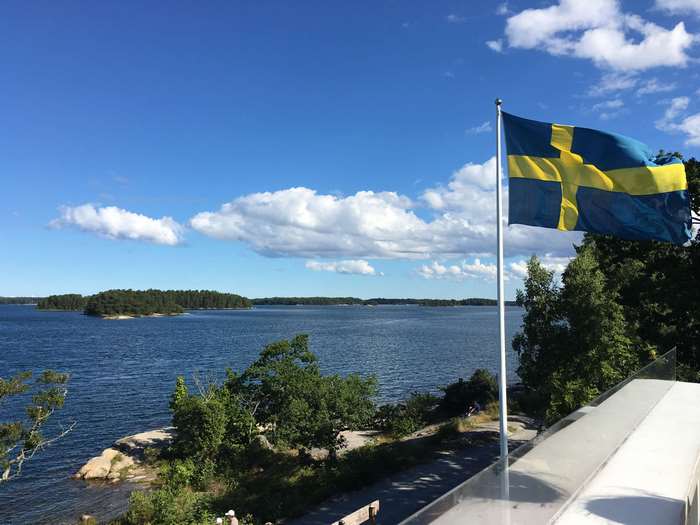 Swedish flag in archipelago, summer 4K