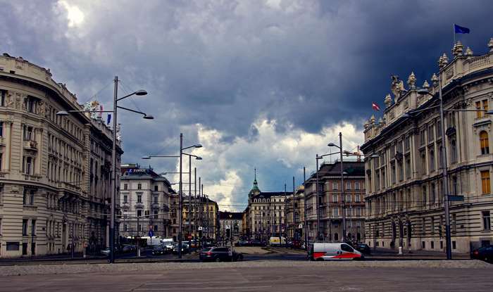Street view of Vienna with historic buildings and cloudy sky