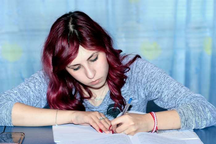 Girl studying and writing 4K