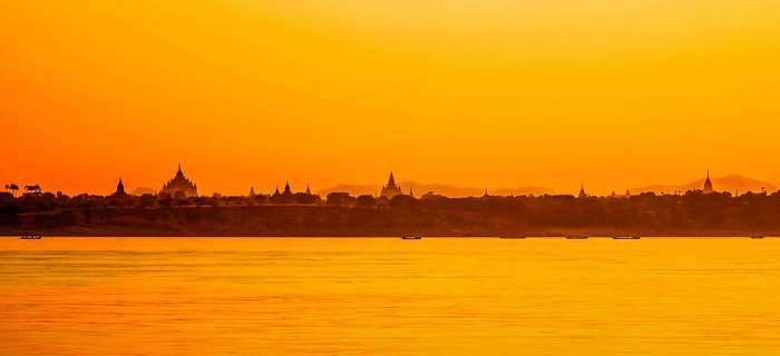 Bagan pagodas and temples at sunset over the Irrawaddy River, Myanmar