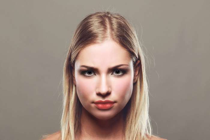 Young woman with blonde hair and makeup