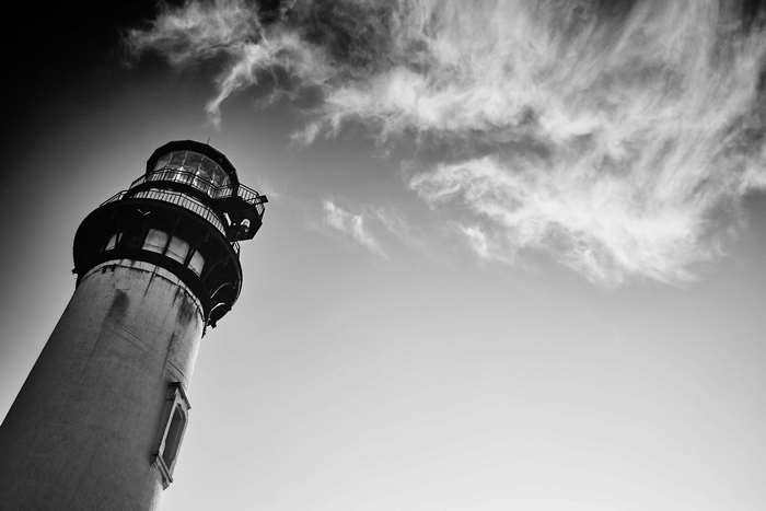Lighthouse against a cloudy sky, low angle shot