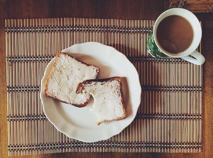Toasted bread with butter and coffee
