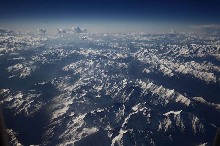Aerial view of snow-capped mountains from an airplane