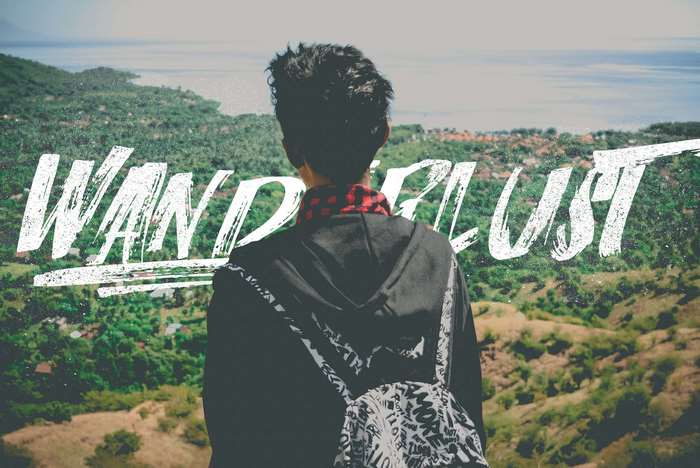 Person with backpack looking at landscape with "Wanderlust" text
