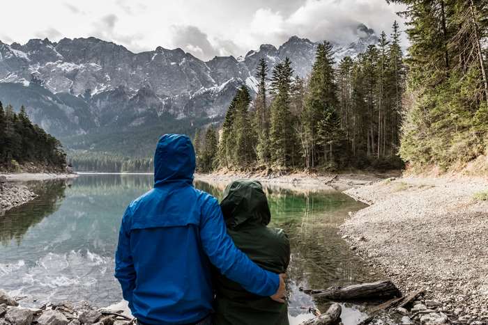 Couple hugging by a mountain lake in Bavaria