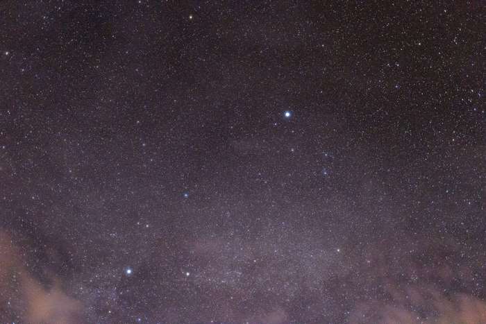 Night sky with stars and clouds