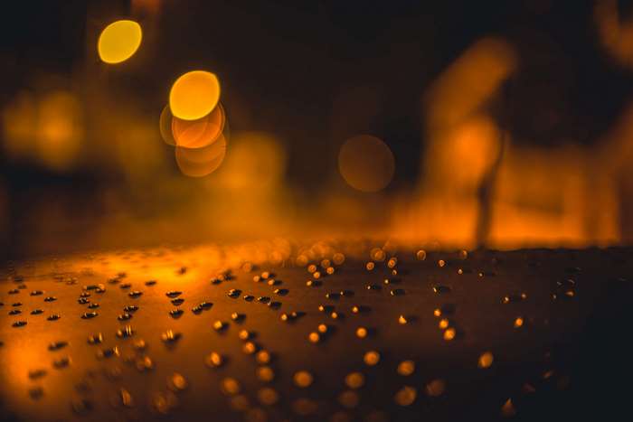 Bokeh lights on a wet surface at night