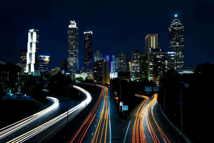 Atlanta skyline at night with light trails on highways