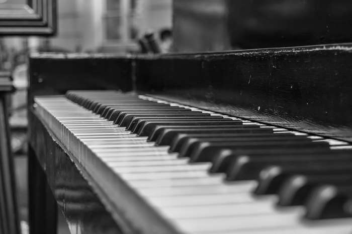 Black and white piano keys with depth of field
