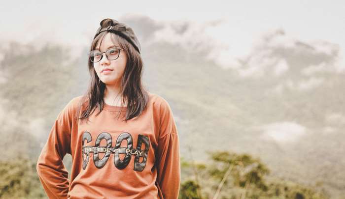 Pretty girl wearing glasses and a cap