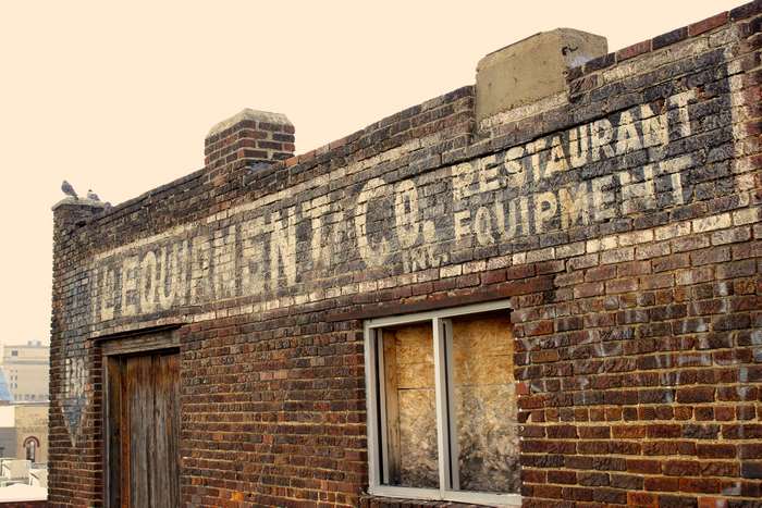 Vintage Restaurant Equipment Building with Pigeons