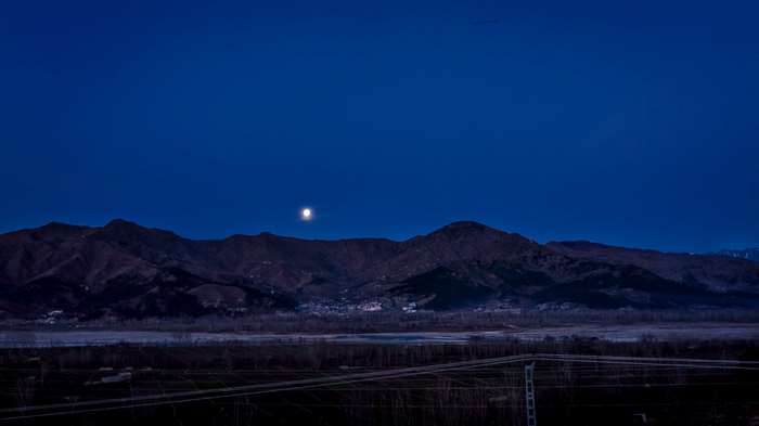 Moonlit mountain landscape at night 4K