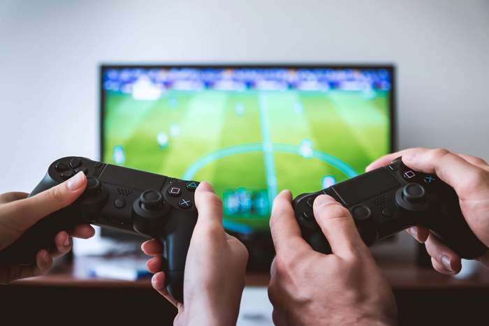 Two Players Engaged in PS4 Wireless Gaming 4K