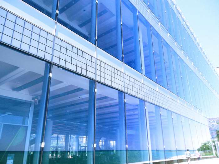 Modern Glass Building Facade with Reflections