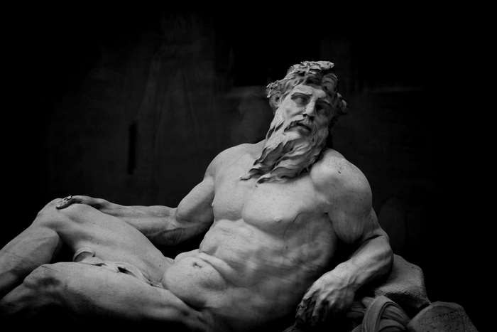 Statue of a muscular man with a beard