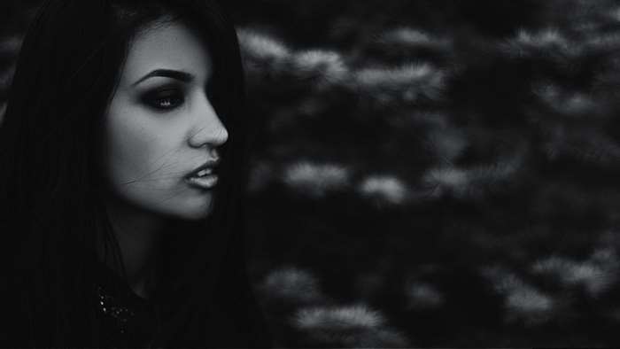 Mystical portrait of a woman with dark makeup